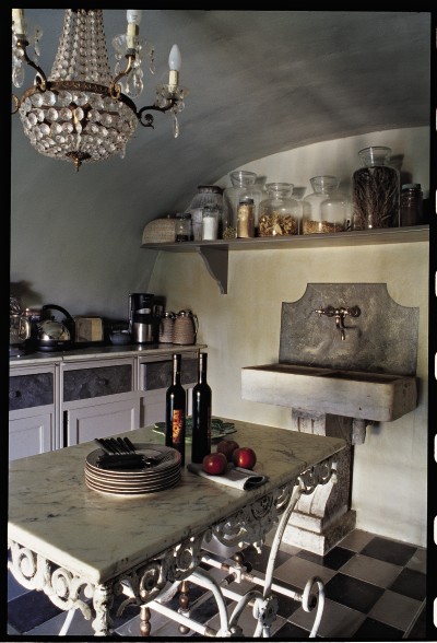 Island Chandeliers on Villa Kitchen With Marble Top Island And Antique Crystal Chandelier
